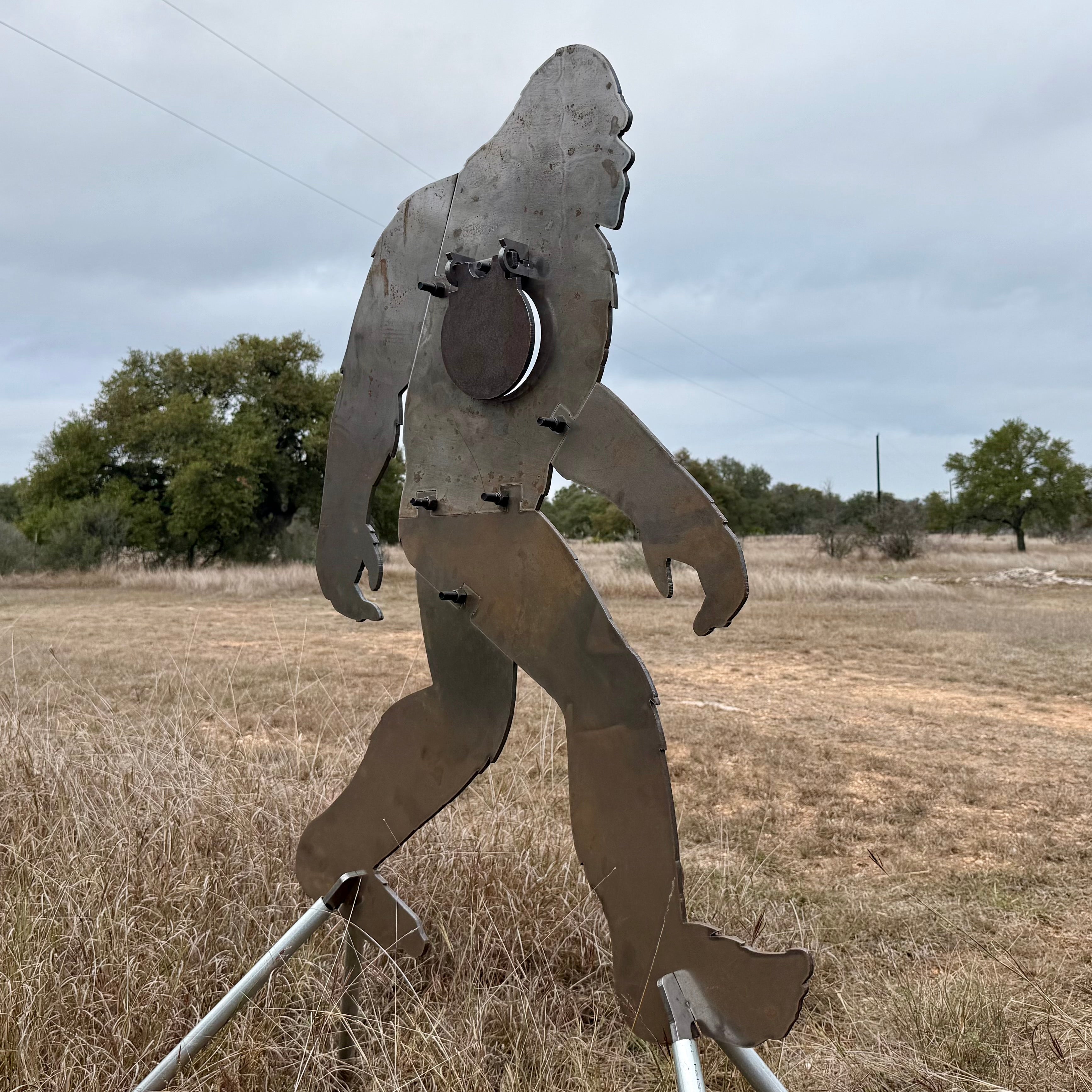 AR500 Steel Sasquatch/Bigfoot silhouette target in a natural outdoor setting